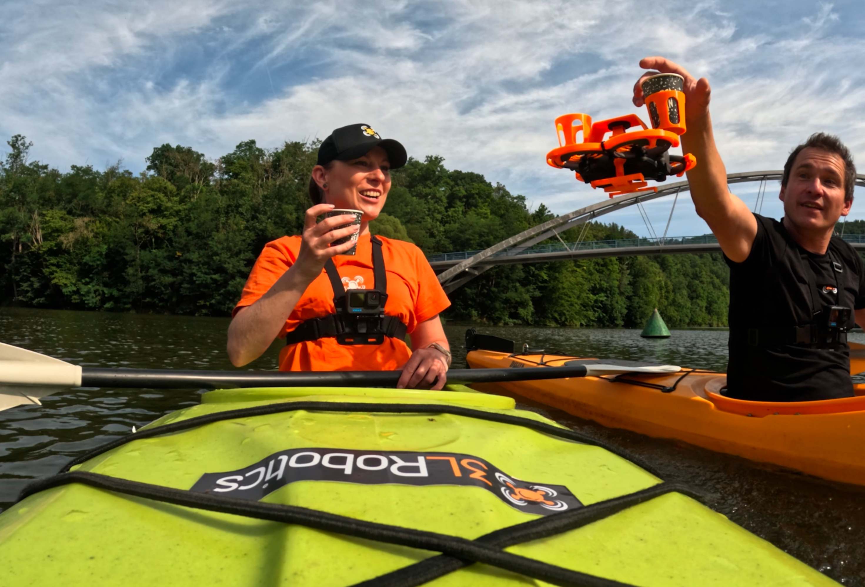 Drone delivering coffee to kayakers on a misty lake